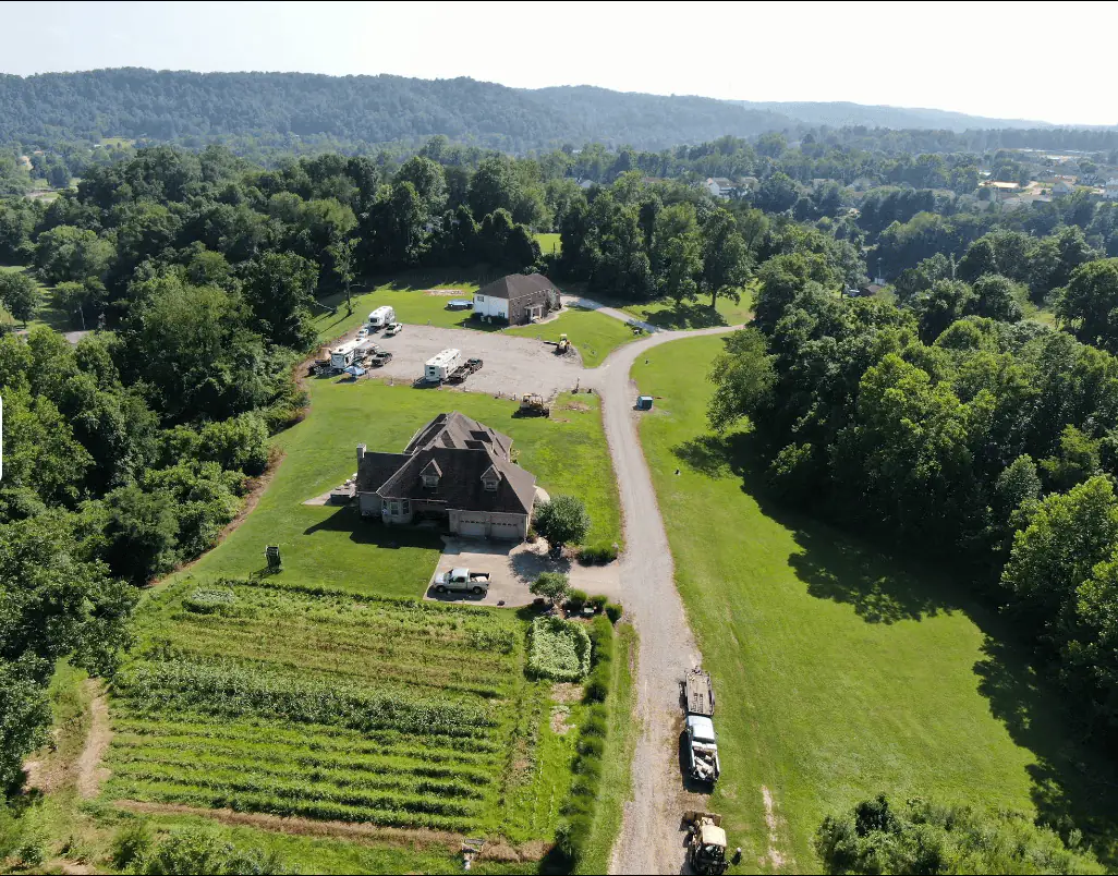 Aerial view of Outlook Pointe Campground showing the graveled lots, the access road and the owners house on site