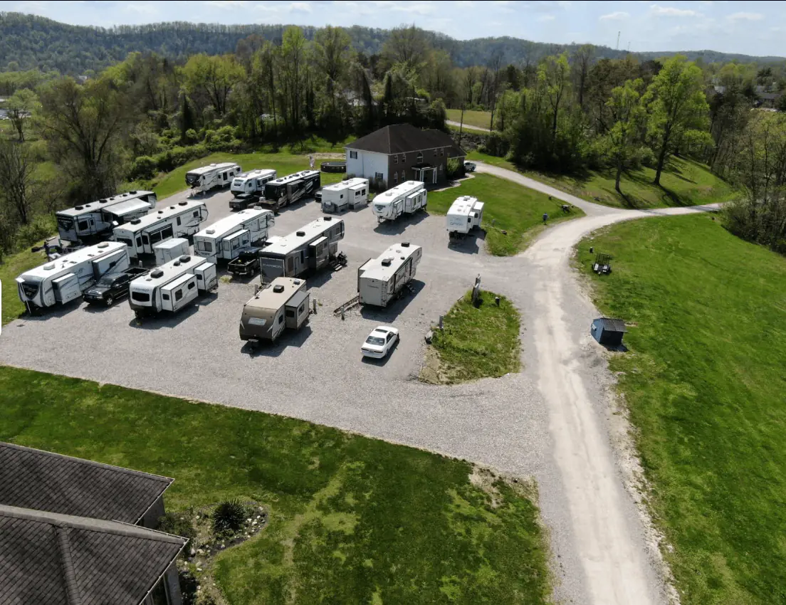 The graveled RV lots at Outlook Pointe seen from above, with rigs parked along the loop